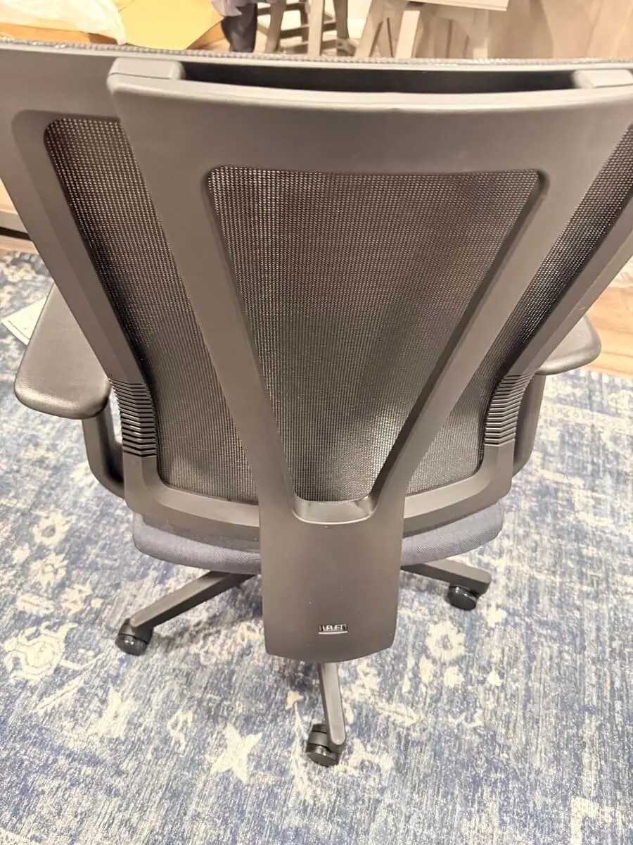 Mesh back of an UPLIFT Clarksville chair showing the lumbar area.