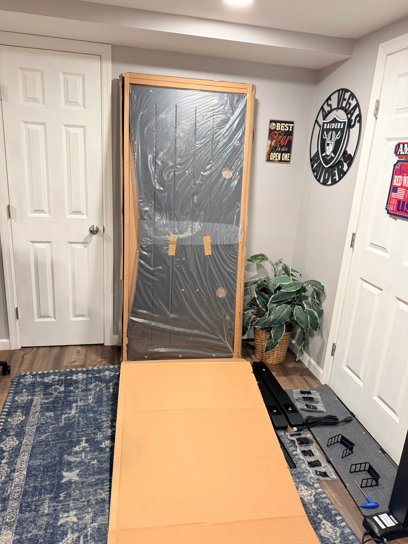 UPLIFT V3 4-Leg desktop protected with plastic and cardboard edge guards before assembly