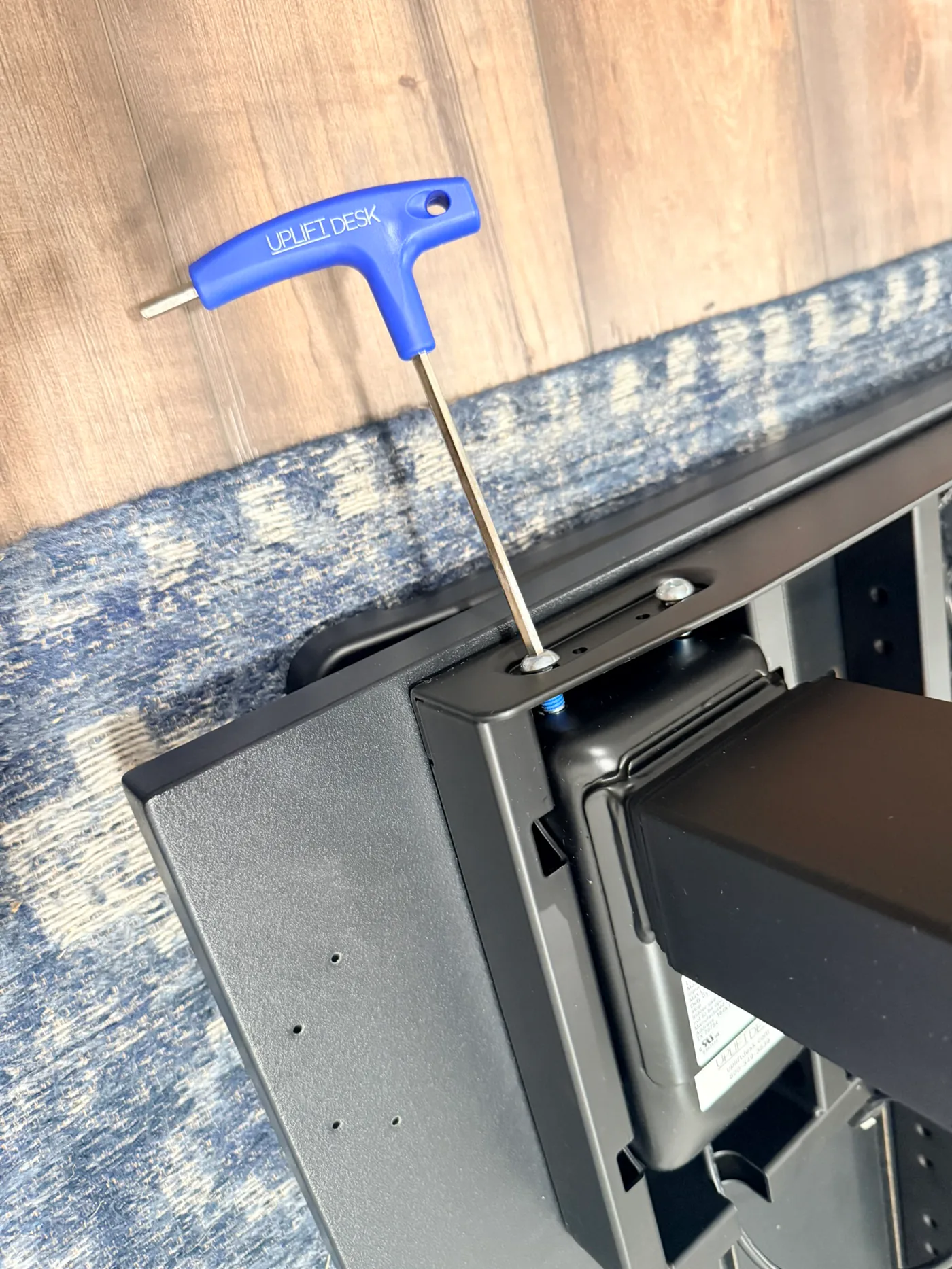 UPLIFT T-handle Allen wrench tightening the two fasteners at a V3 4-Leg frame corner
