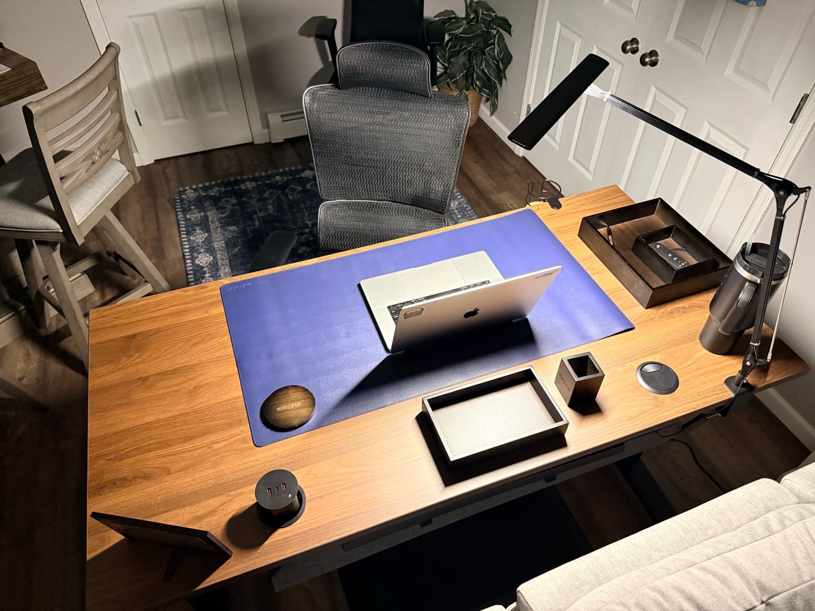 Full UPLIFT workstation — V3 standing desk, Clarksville chair, walking pad, and accessories after 7 weeks of daily use